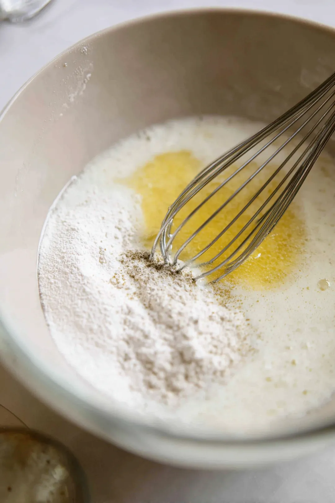 Combine lukewarm water, active dry yeast, and sweetener in a mixing bowl