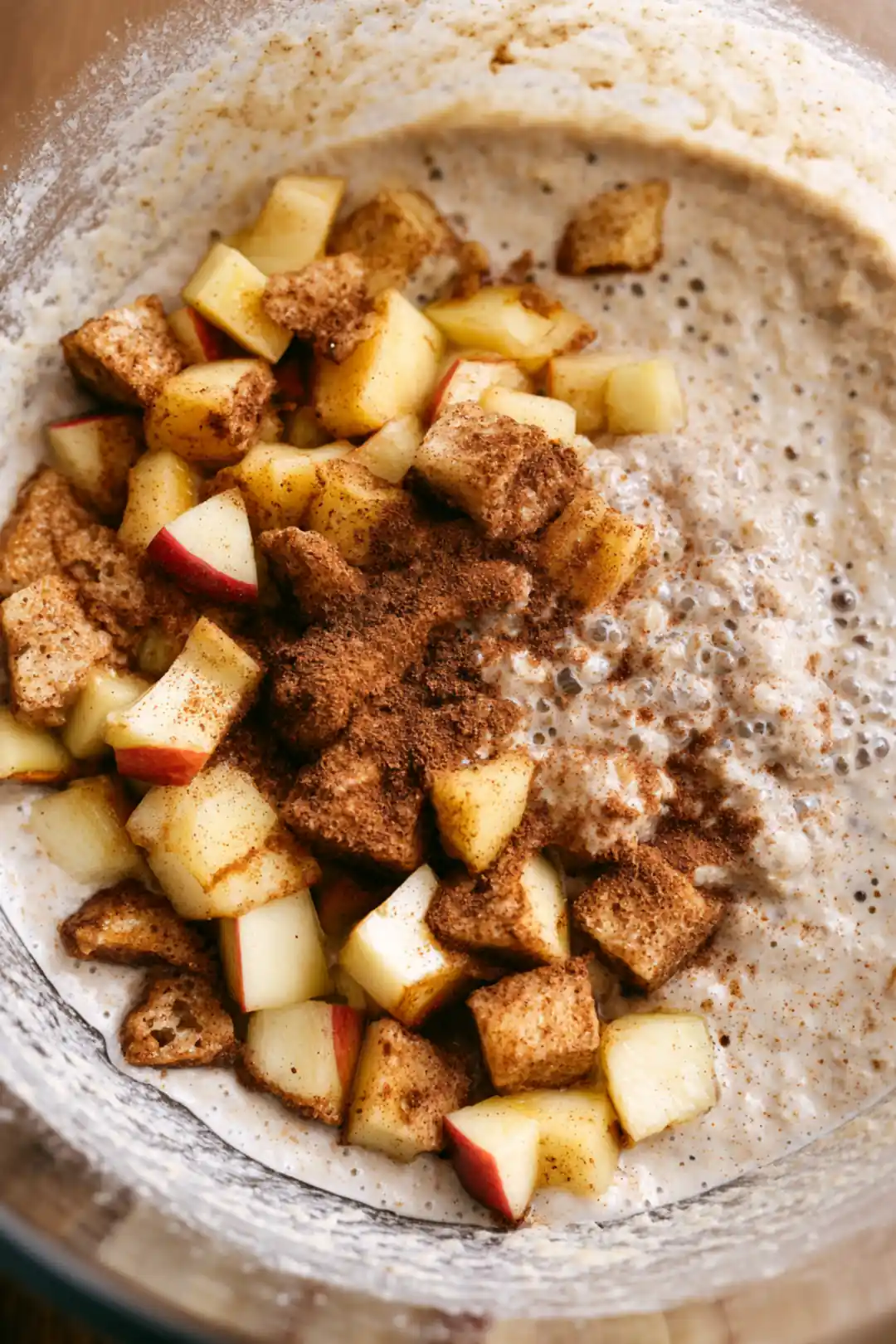 Combine pancake mix, water, diced apples, and cinnamon in a mixing bowl until well blended