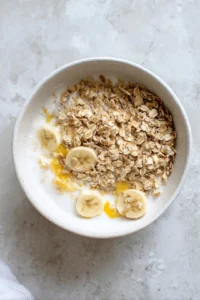 Combine rolled oats, milk, egg, and mashed banana in a large bowl