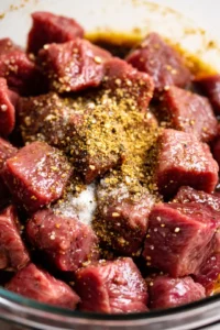 Combine steak pieces with Worcestershire sauce, garlic powder, salt, and black pepper