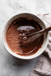Combine the all-purpose flour, sugar, cocoa powder, and melted butter in a mixing bowl