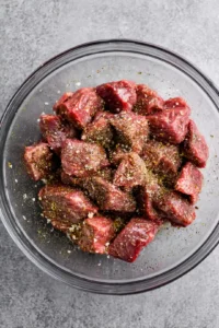 Combine the sirloin steak pieces with olive oil, garlic powder, onion powder, salt, and pepper