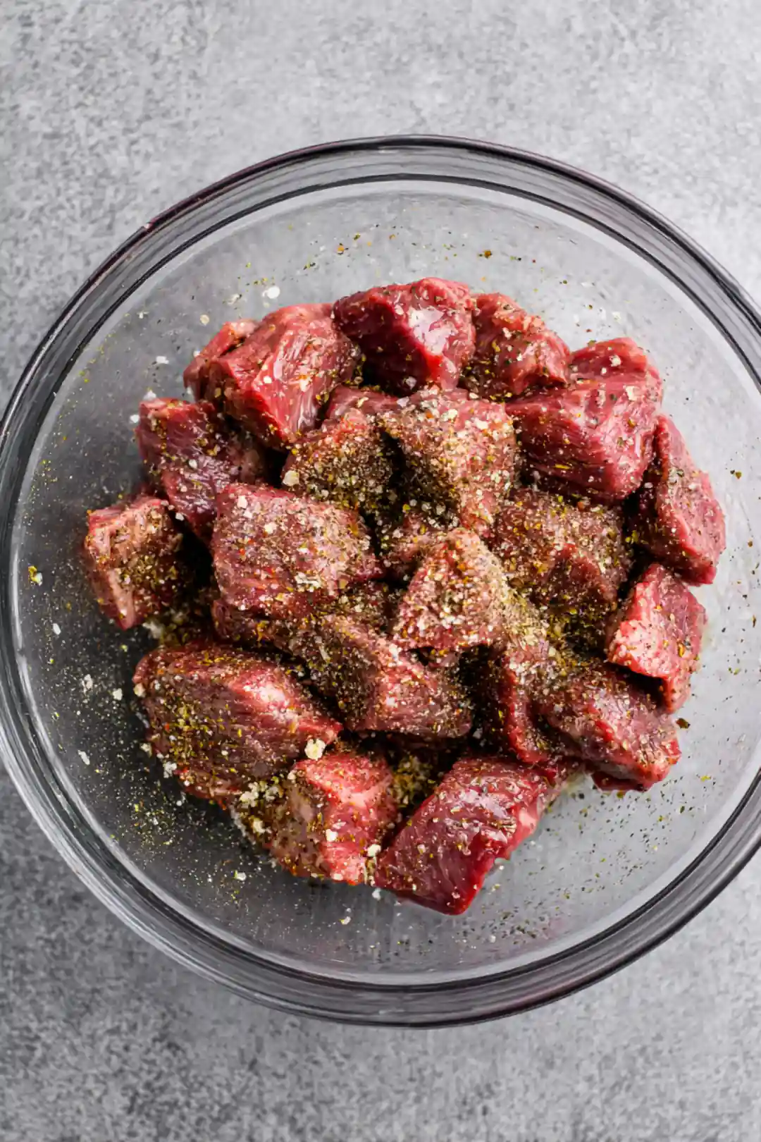 Combine the sirloin steak pieces with olive oil, garlic powder, onion powder, salt, and pepper