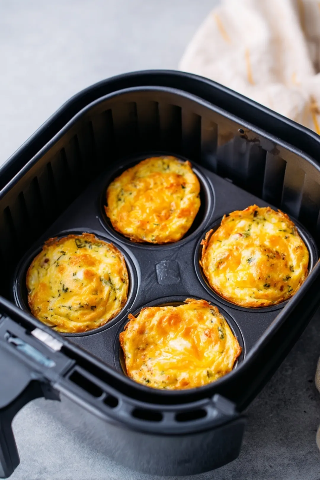 Cook eggs in air fryer until set and lightly browned