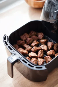 Cook steak bites in air fryer until browned
