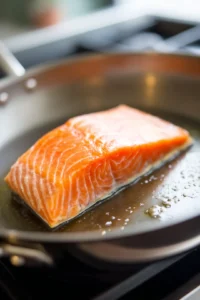 Cook the salmon fillet in a skillet over medium heat for about 6-8 minutes on each side
