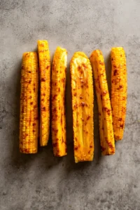Cut corn into rib-like sections, brush with gochujang sauce