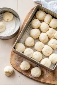 Cut the biscuit dough into quarters