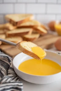 Dip bread sticks in egg mixture and air fry with butter