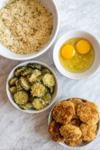 Dip each dill pickle chip into the egg, then coat evenly with panko breadcrumbs
