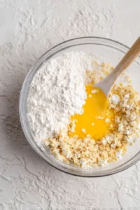 Dip each ice cream ball into flour, then egg, and finally coat with cornflakes