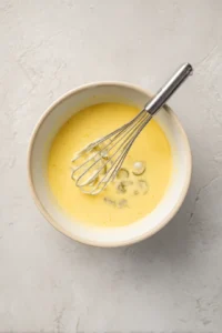 Dip pickle slices into a wet mixture and coat with dry mixture