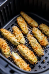 Dredge pickle spears in almond flour mixture and air fry until golden and crispy
