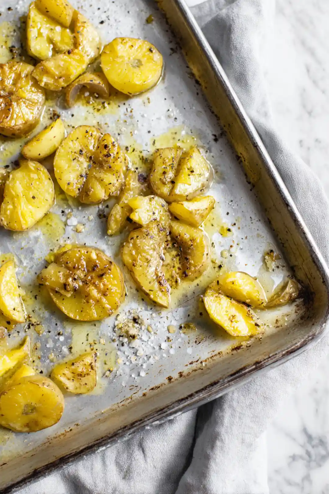 Drizzle melted garlic butter over smashed potatoes