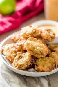 Fry coated pickles until golden brown