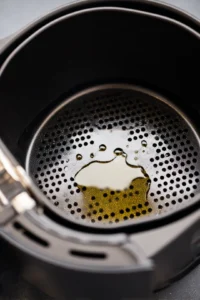 Grease your air fryer basket with cooking oil to prevent sticking.
