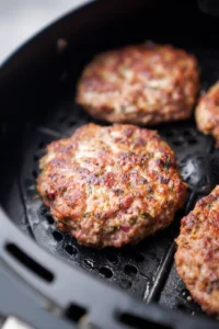 Layer tortillas with burger patty, lettuce, tomatoes, and cheese