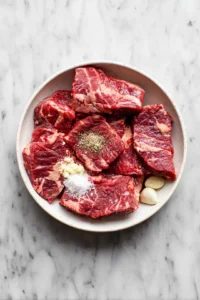 Marinate beef belly with soy sauce, salt, minced garlic, and black pepper for at least 2 hours