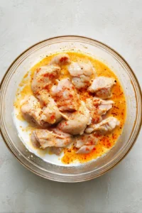 Marinate chicken in buttermilk, honey, and paprika