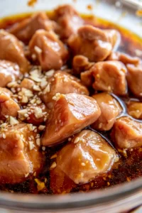 Marinate chicken pieces in orange juice, soy sauce, ginger, and garlic for at least 15 minutes
