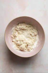 Mix masa harina with water and salt to form dough, divide into balls and flatten using a tortilla press