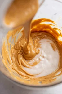 Mix peanut butter, sugar, and egg until smooth