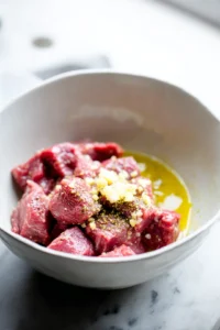 Mix sirloin steak with butter, garlic, salt, and pepper