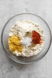 Mix the dry ingredients for coating the pickles