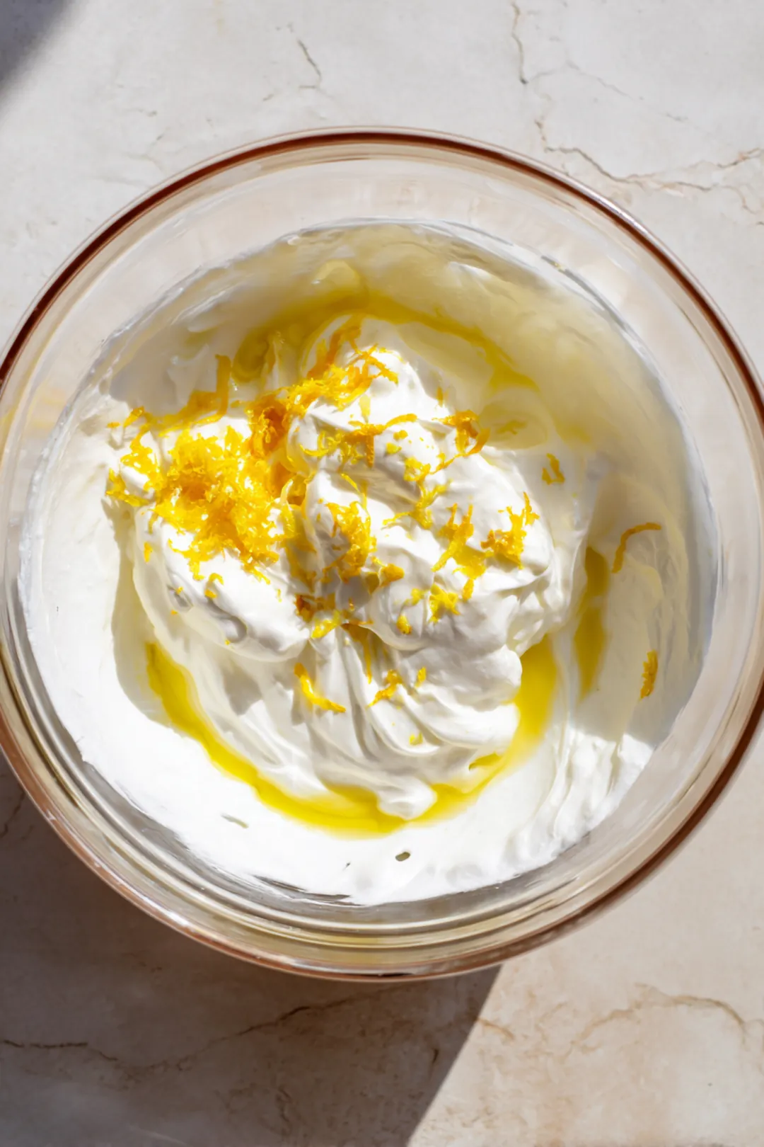 Mix vanilla extract, egg, lemon juice, lemon zest, and sour cream until fully combined