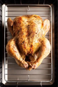 Place chicken on roasting rack and let it sit uncovered in refrigerator for at least 24 hours