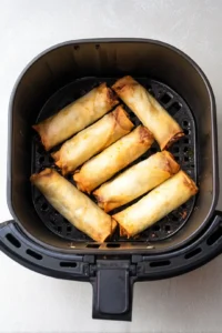 Place egg rolls in the air fryer basket