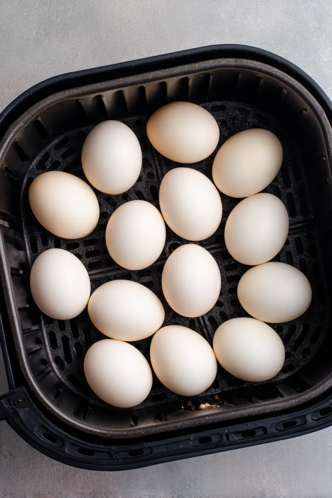 Place eggs in the air fryer basket in a single layer