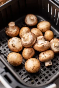 Place mushrooms in air fryer and cook for 10 minutes with cheese