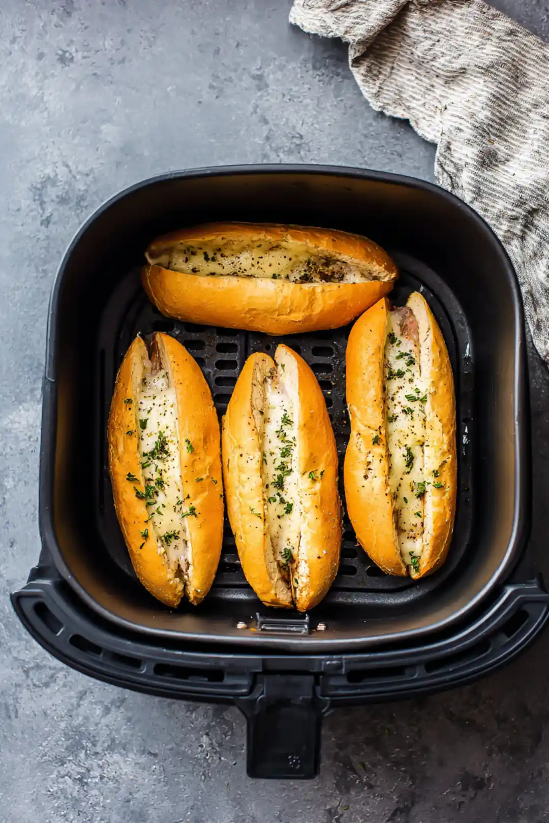 Place the assembled sandwiches in the air fryer basket in a single layer and air fry until cheese is melted and bread is crispy