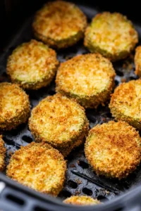 Place the breaded pickle chips in a single layer in the air fryer basket
