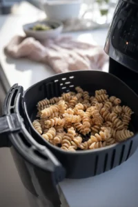 Place the pasta in the air fryer in a single layer and fry until golden and crispy