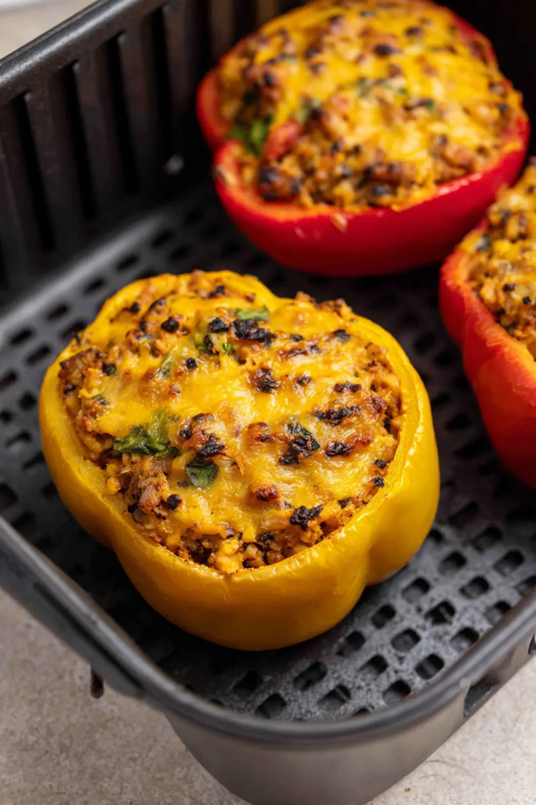 Place the stuffed peppers in the air fryer basket and cook until tender