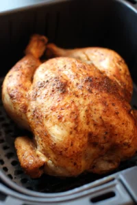 Place the whole chicken in the air fryer and cook it at 360°F for 60 minutes