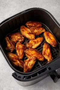 Place wings in air fryer basket in a single layer and cook for 25 minutes, flipping halfway through for maximum crispiness.
