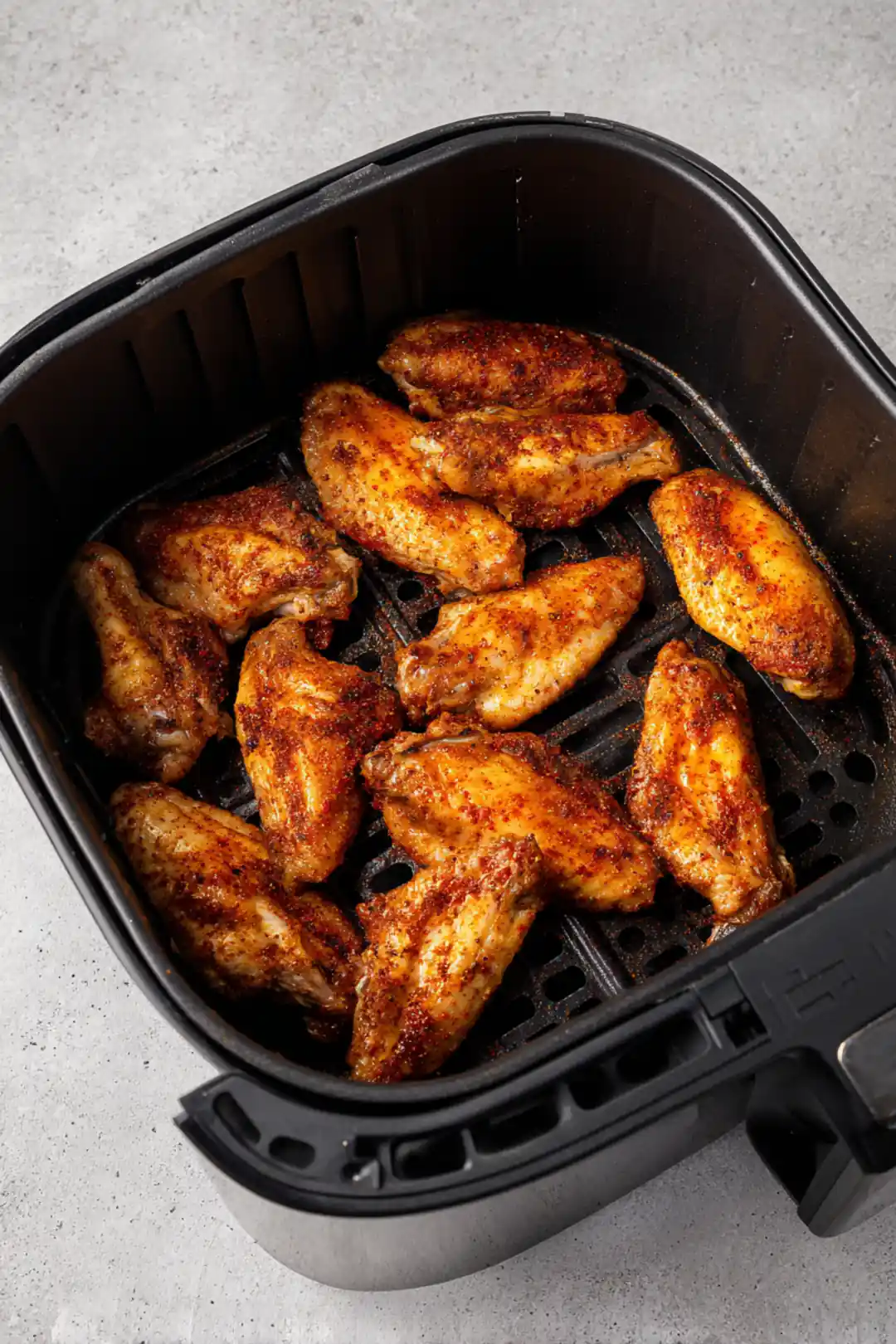 Place wings in air fryer basket in a single layer and cook for 25 minutes, flipping halfway through for maximum crispiness.