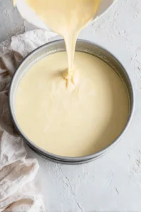 Pour cheesecake mixture into an air fryer-safe pan