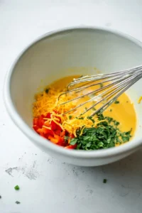 Pour egg mixture into muffin cups