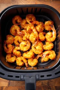 Preheat the air fryer and cook shrimp until golden brown