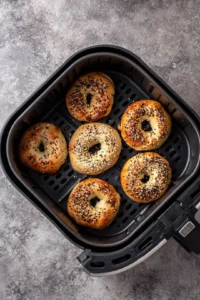 Preheat the air fryer and place bagels in the basket