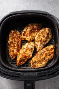 Preheat the air fryer to 375 degrees Fahrenheit and cook chicken breasts