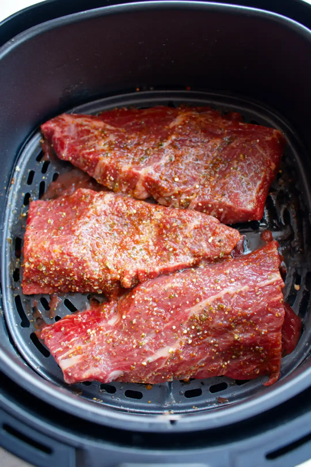 Preheat the air fryer to 380°F (193°C). Place the marinated beef belly in the air fryer basket and cook for 30 minutes, flipping halfway through until golden brown and crisp.