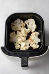 Preheat your air fryer to 400 degrees Fahrenheit while preparing the cauliflower steaks