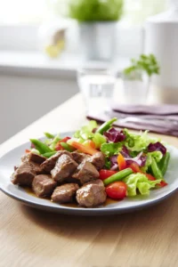 Prepare sides and serve steak bites with salad greens and steamed vegetables