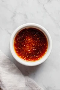 Prepare the marinade by combining soy sauce, gochujang, honey, sesame oil, and rice vinegar in a large bowl