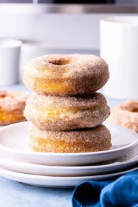Scoop the batter into a donut pan, filling each cavity about halfway and place the pan in the air fryer to cook for 8-10 minutes.